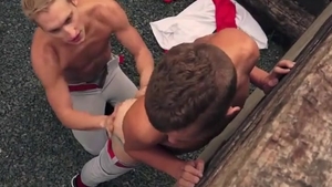 Two Baseball boys plowing Each Other